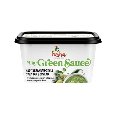 A container of green sauce with a black lid.
