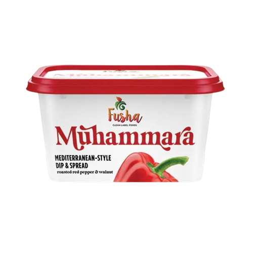 A container of mayonnaise with tomato on top.